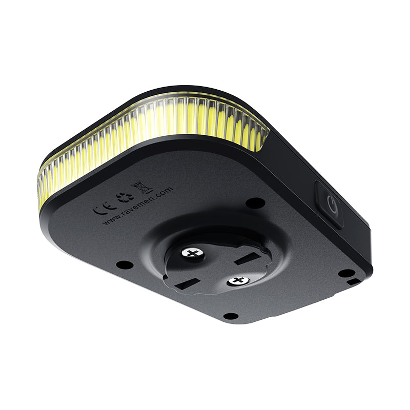 Underside view of the Ravemen FR300 ANT+ showing the mounting screws, power button and regulatory markings.