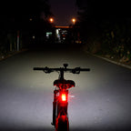 Ravemen PR2400 casting an anti-glare flood beam on a night street ride.