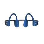 Runner wearing Shokz OpenRun blue bone conduction headphones outdoors