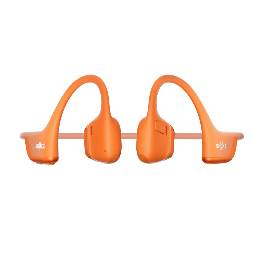 Shokz OpenRun Pro 2 orange headphones shown at a side angle highlighting the earhook design.
