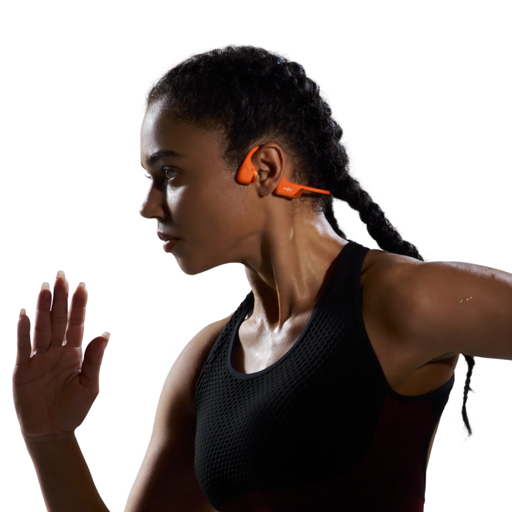 Shokz OpenRun Pro 2 orange bone conduction headphones viewed from an angled perspective.