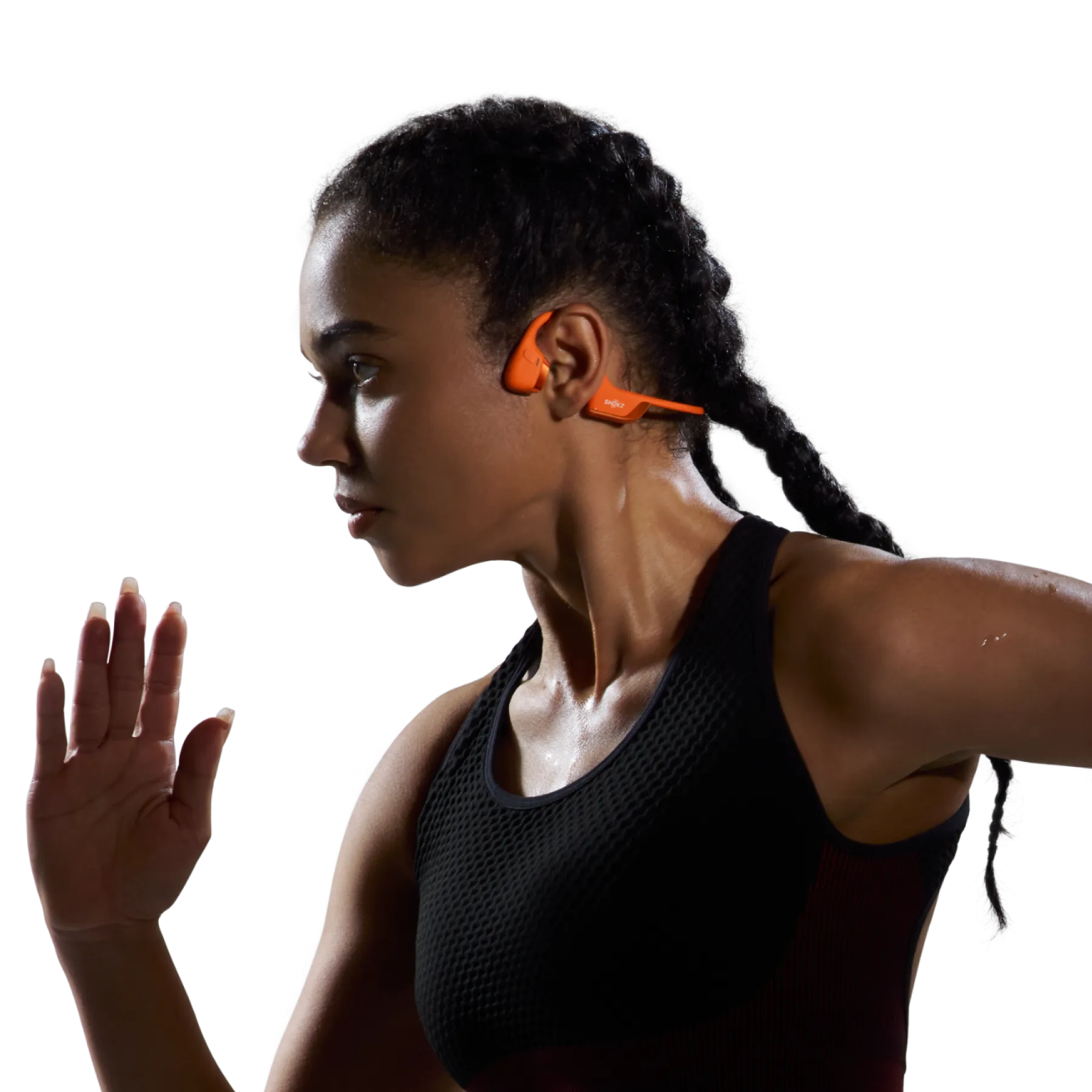 Shokz OpenRun Pro 2 orange bone conduction headphones viewed from an angled perspective.