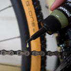 Close-up of Dynamic Ultra² 50ml bottle, highlighting its premium formula for all-weather bike chain efficiency.
