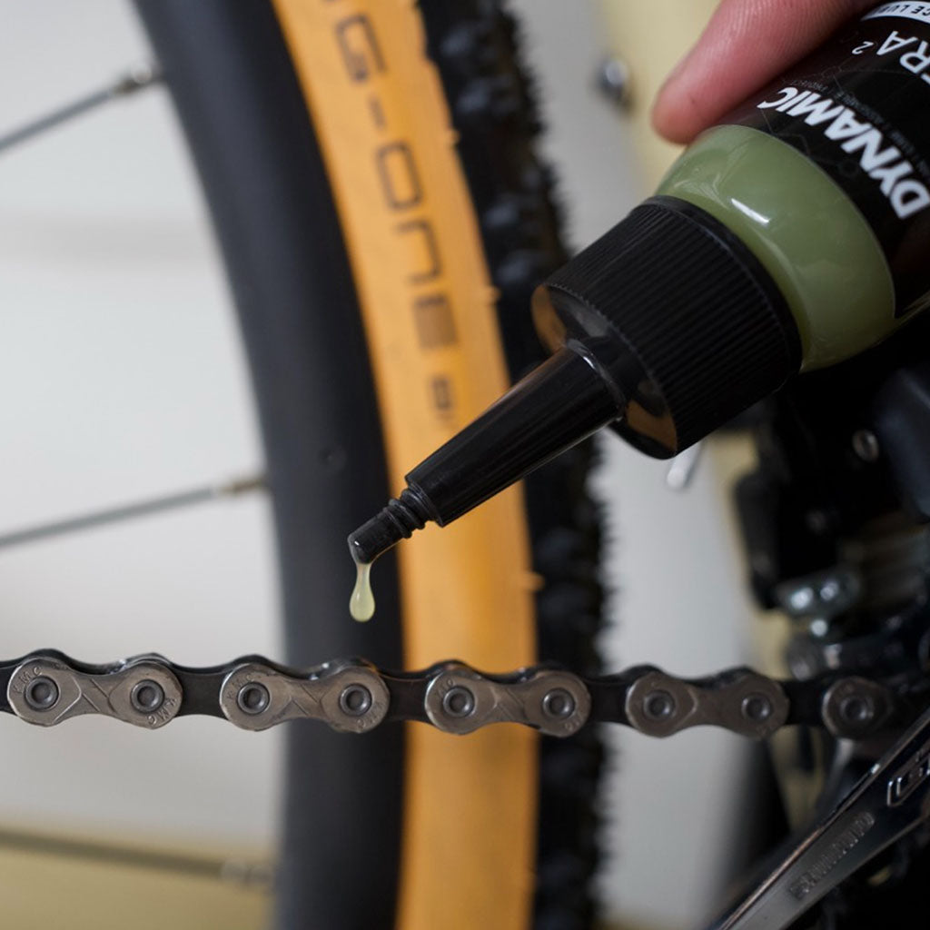 Close-up of Dynamic Ultra² 50ml bottle, highlighting its premium formula for all-weather bike chain efficiency.