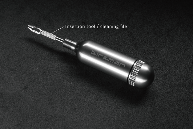 A close-up of the Birzman tubeless repair kit, highlighting its comfortable grip and CO2 inflation solution.

