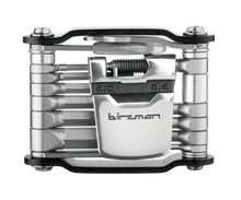 A close-up of the Birzman Feexman E-Version 20 multi-tool, showing the integrated tire levers and chain tool.

