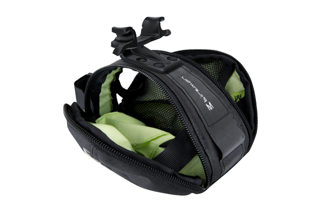 Close-up of the Birzman M-Snug Saddle Bag's interior, showing the layout for individual items.

