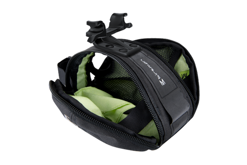 Close-up of the Birzman M-Snug Saddle Bag's interior, showing the layout for individual items.

