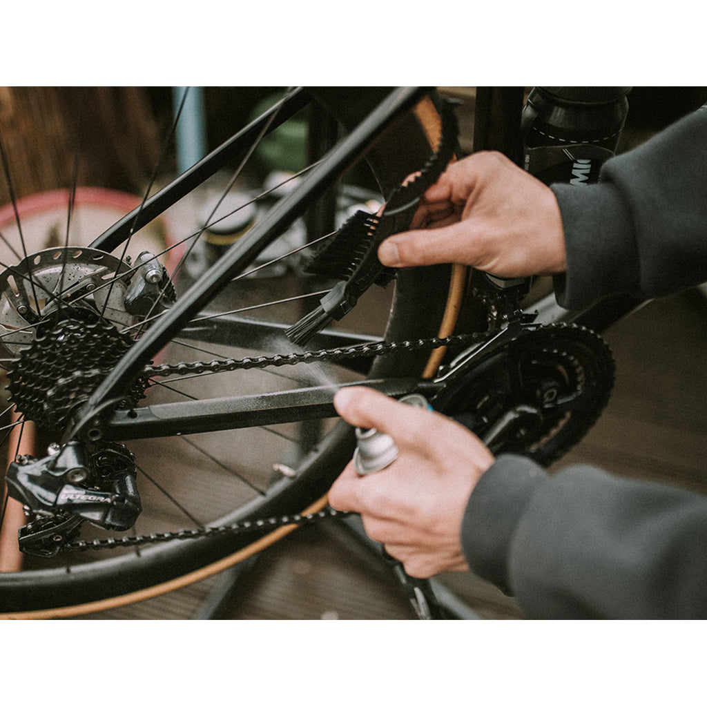 Image of the Dynamic Claw Brush, showcasing its sturdy design and specialized bristles for effective deep cleaning of muddy bike drivetrains.