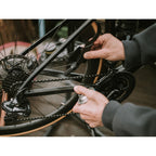 Image of the Dynamic Claw Brush, showcasing its sturdy design and specialized bristles for effective deep cleaning of muddy bike drivetrains.