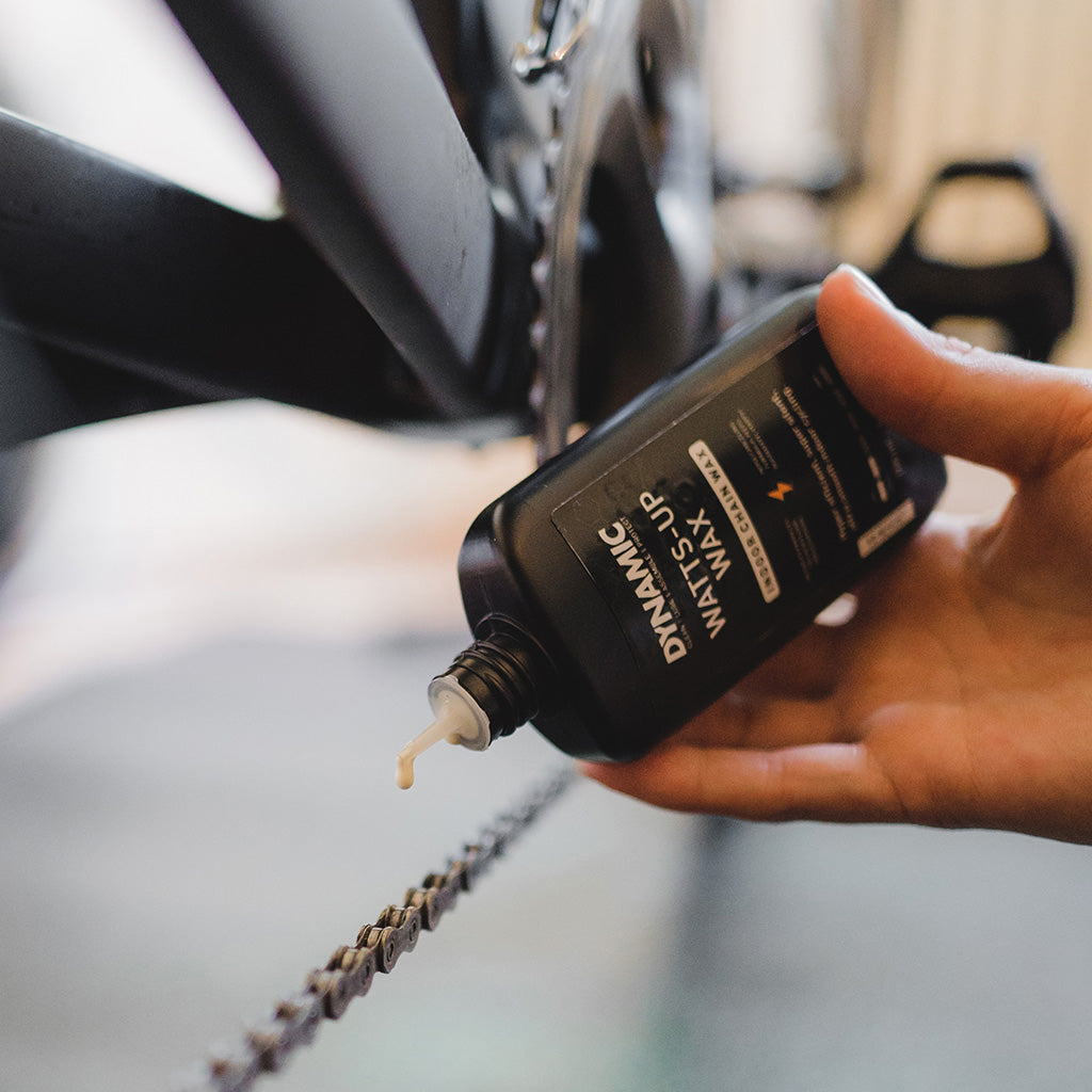 A 100ml container of Dynamic Watts-Up Wax Indoor Wax, essential for maintaining quiet and smooth performance during indoor bike training sessions.

