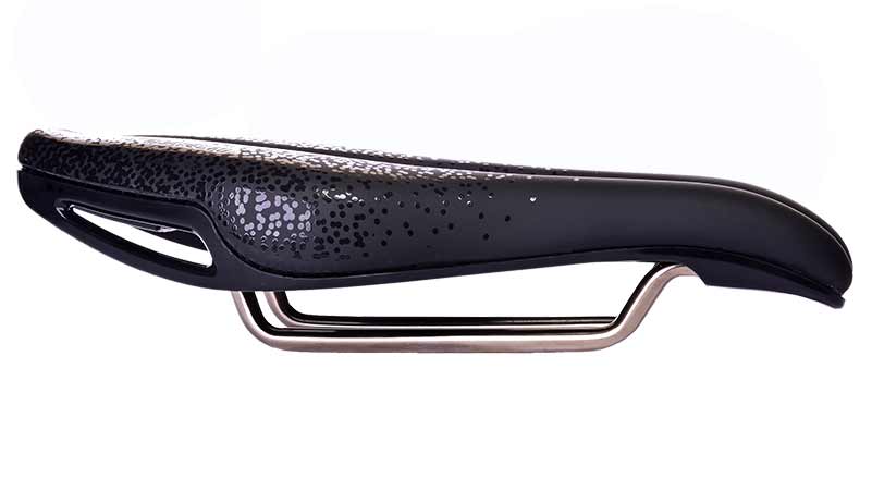 A side-view of the black ISM PN 4.0 bicycle saddle, highlighting its sleek design and increased sit bone contact points.

