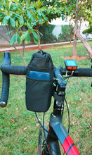 Trek N Ride Cycle Handlebar Bottle & Mobile Pouch attached to a bike, holding a water bottle and smartphone.

