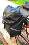 Trek N Ride bicycle pannier bag showing reflective straps for enhanced visibility.

