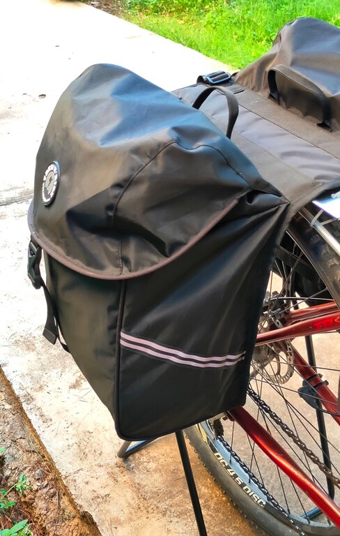 Trek N Ride bicycle pannier bag showing reflective straps for enhanced visibility.

