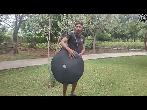 Durable 1000D polyester cycle wheel bag with shoulder strap.