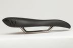 ISM PL 1.0 black bike saddle, designed to eliminate pressure, numbness, and soft tissue discomfort. Ideal for a healthier, more enjoyable ride on high-performance bicycles.

