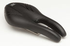 Black ISM PL 1.0 performance long saddle. This nose-less bike seat is 275mm long and 135mm wide, providing comfort and support for high-performance cycling.


