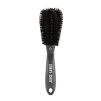 Close-up of Juice Lubes Double Ender brush, showing its two prongs and stiff bristles for effective grime removal from bike gears.

