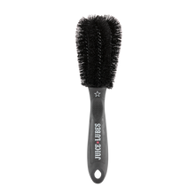 Close-up of Juice Lubes Double Ender brush, showing its two prongs and stiff bristles for effective grime removal from bike gears.

