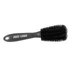 A Juice Lubes Double Ender brush, an essential tool with a two-pronged design for precision cleaning of bicycle cogs and derailleur pulleys.