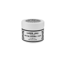 Close-up of Juice Lubes Carbon Juice (50ml), highlighting its formula for increasing grip and preventing slippage on carbon components.