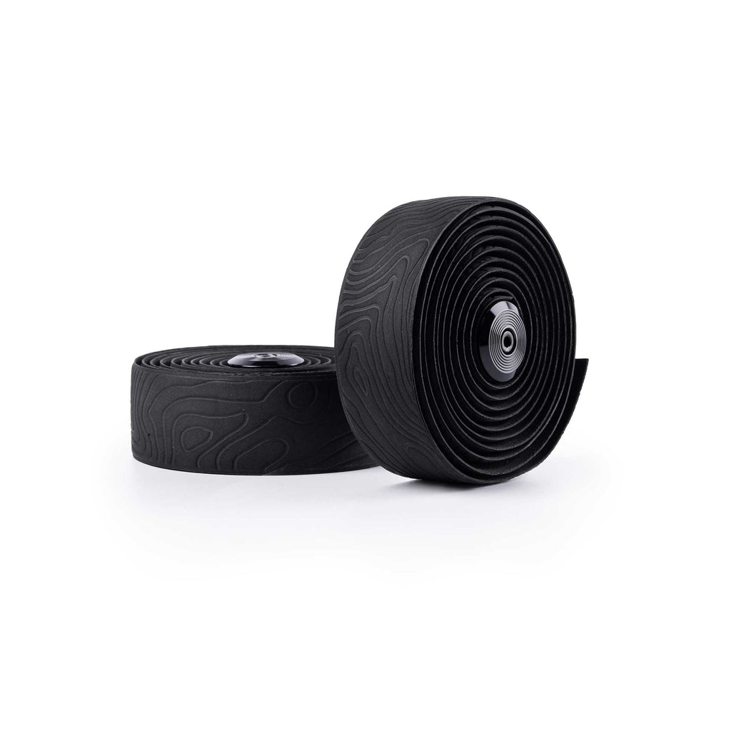 A product image of the Guee Sio Dura Silicone Bartape, unrolled to show its unique non-adhesive design that allows for re-wrapping multiple times without leaving residue.